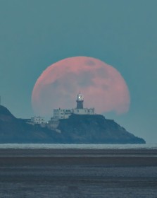 Snow Moon rising over Baily Lighthouse, Howth