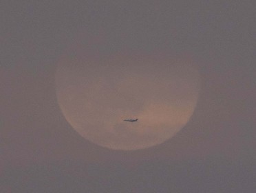 Plane and Moon by Gerry Moloney