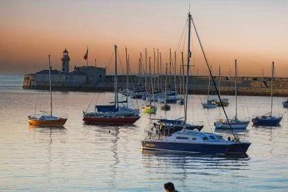 Dun Laoghaire pier at sunset by Pat Divilly