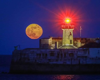 Moon over Dun-Laoghaire by John Coveney